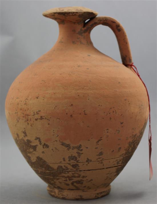 A Roman terracotta flagon, c.2nd century AD, 19cm